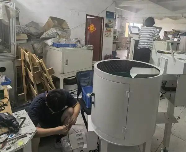 Workshop assembly of a custom vibratory bowl feeder enclosure