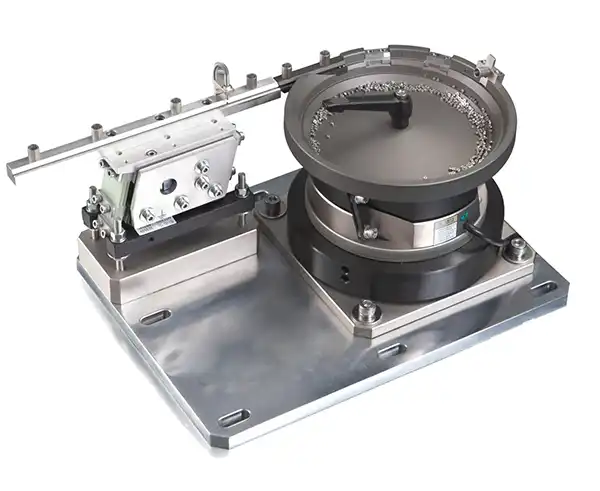 Completed vibratory bowl feeder with linear transfer track